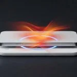 Smartphone charging on a Qi wireless pad with orange heat visualization showing thermal impact
